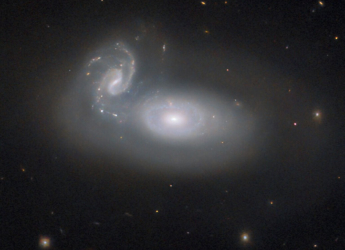 Hubble Telescope Captures Image of Merging Galaxies in Coma Cluster, 390 Million Light-Years Away