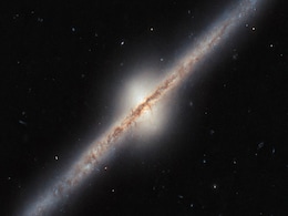 Hubble Space Telescope Captures Rare Edge-On View of a Spiral Galaxy Located Millions of Light-Years Away Hubble Space Telescope Captures Rare Edge-On View of a Spiral Galaxy Located Millions of Light-Years Away