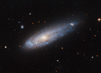 Hubble Space Telescope Unveils IC 3225, the Cannonball Galaxy in Virgo