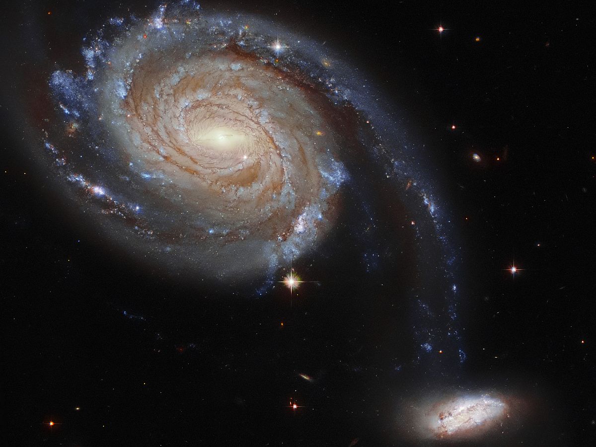 NASA Shares Dramatic Image of 2 Galaxies Locked in a Cosmic Dance