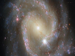 Hubble Spots Isolated Barred Spiral Galaxy That’s Secretly Part of a Cosmic Duo Hubble Spots Isolated Barred Spiral Galaxy That’s Secretly Part of a Cosmic Duo