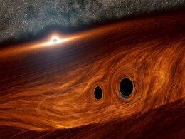 Scientists Spot Light Flare From a Black Hole Collision for the First Time Ever Scientists Spot Light Flare From a Black Hole Collision for the First Time Ever
