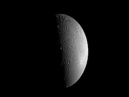 NASA Shares Stunning Image of Saturn’s Moon Dione in Transit NASA Shares Stunning Image of Saturn’s Moon Dione in Transit