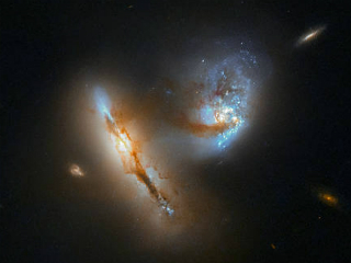 NASA&#039;s Hubble Space Telescope Captures Two Galaxies Interacting, Distorting