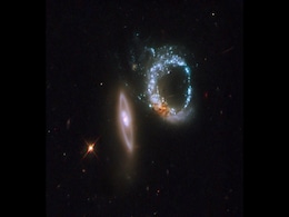 NASA's Hubble Captures a Pair of Interacting Galaxies Forming the Number '10' in Space NASA's Hubble Captures a Pair of Interacting Galaxies Forming the Number '10' in Space