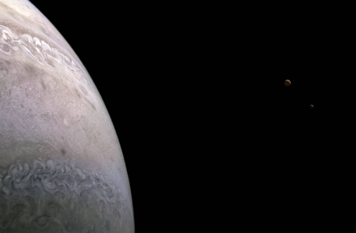 Jupiter's Moons Io and Europa Captured by NASA's Juno During Recent Close Flyby