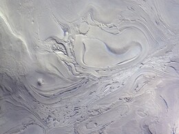ESA Shares Photo Of One of The Biggest Impact Basins On Martian Surface ESA Shares Photo Of One of The Biggest Impact Basins On Martian Surface