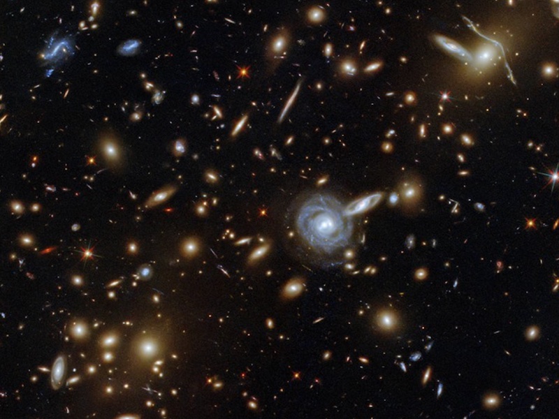 NASA's Hubble Telescope Captures Image Of Galaxy Cluster 3.5 Billion Light-Years Away