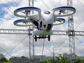 NEC Unveils Flying Car Prototype in Japan, Hovers 10 Feet Above Ground for a Minute in Public Test