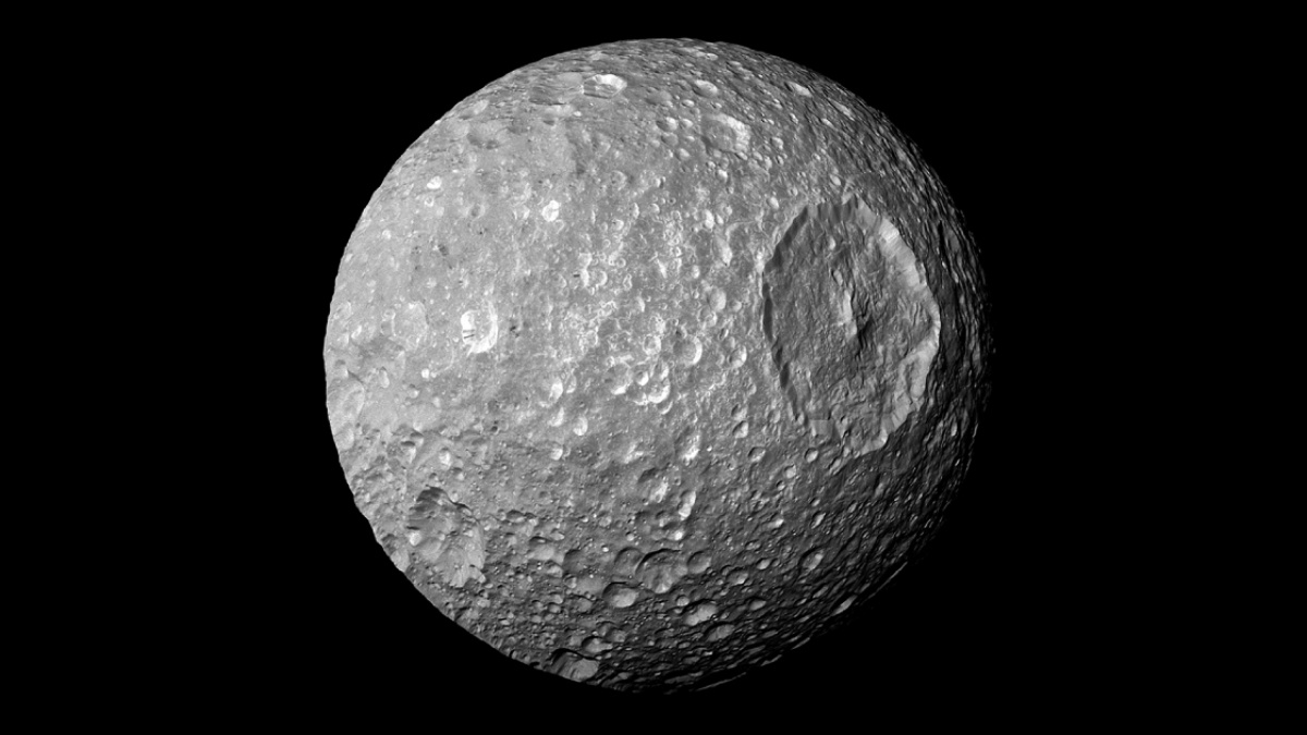 Mimas, a Tiny Moon Orbiting Saturn, Could Be Hiding an Ocean Beneath Its Frozen Surface
