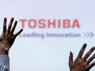 Toshiba Signs Deal to Sell Chip Unit to Bain-Led Group for $18 Billion